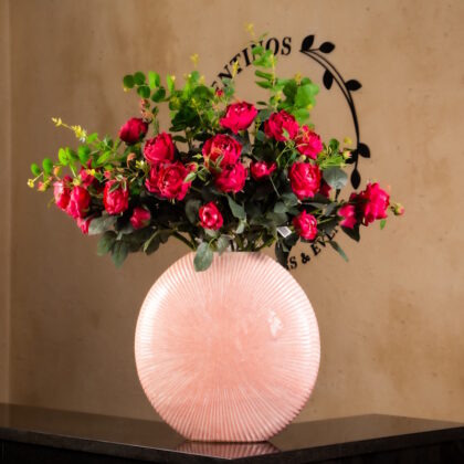 Red Roses in Round Pink Ceramic Vase
