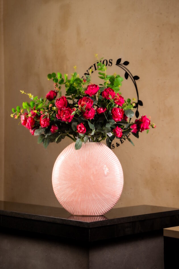 Red Roses in Round Pink Ceramic Vase